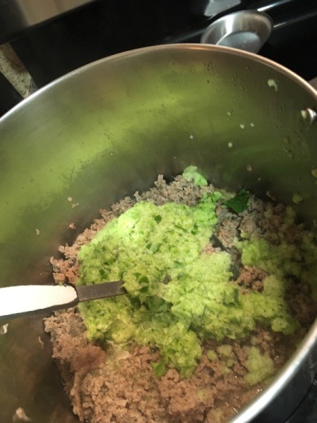 adding vegetables Sausage in pot