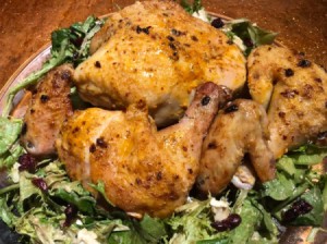 cooked chicken on a bed of lettuce