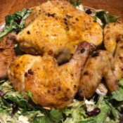 cooked chicken on a bed of lettuce