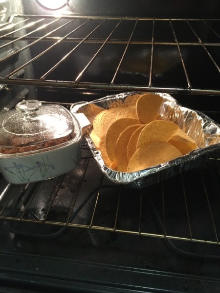 taco shells and meat mix in the oven