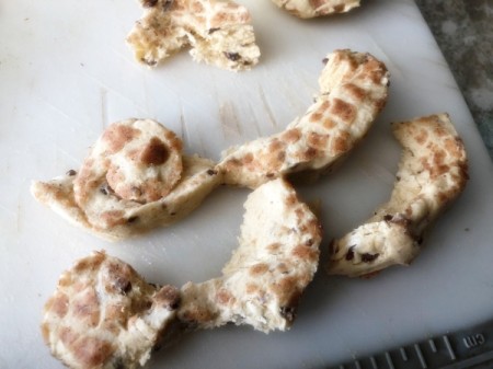 pulling apart cinnamon roll dough