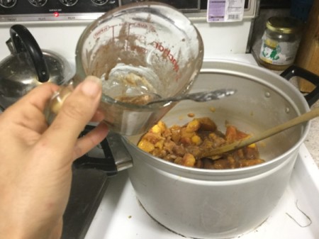 adding ingredients to pan