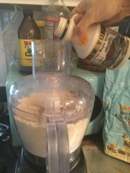 adding maple syrup to processor