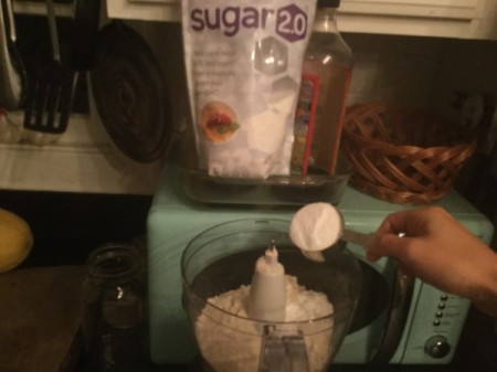 adding sugar to food processor