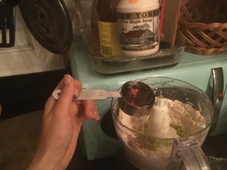 adding oil to processor