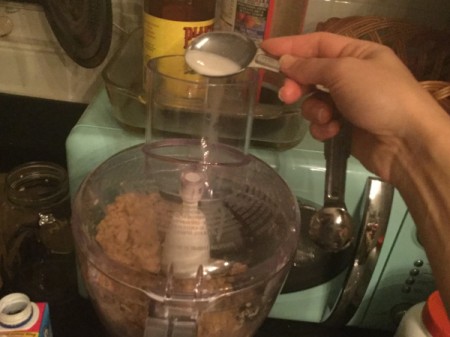 adding milk to processor