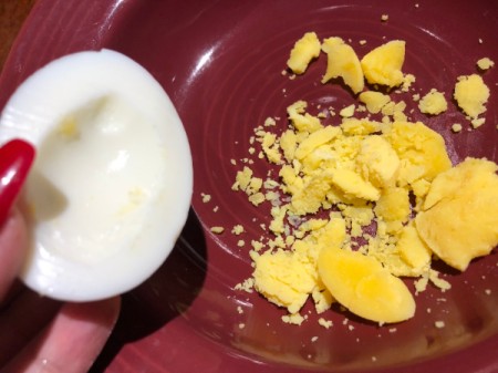 removing egg yolk from half