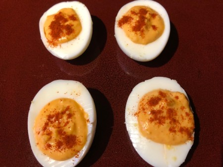 sprinkled paprika on Deviled Eggs