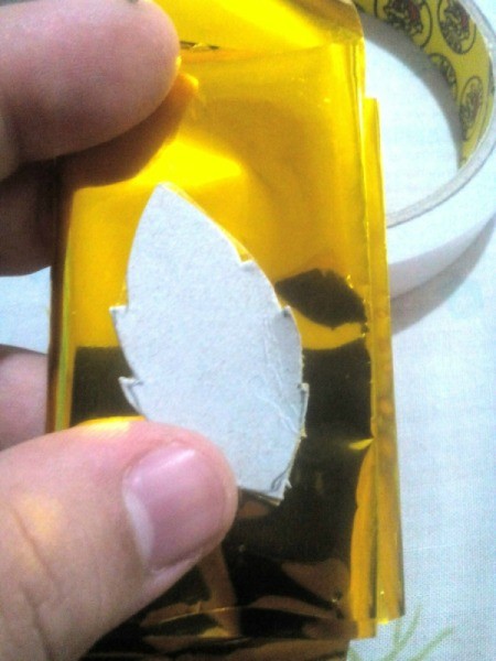 Laurel Leaf Headdress - stick a leaf template to the folded paper and cut out several leaves at the same time