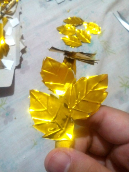 Laurel Leaf Headdress - stick the gold leaves to both sides of the foil covered cardboard leaves onto the ring