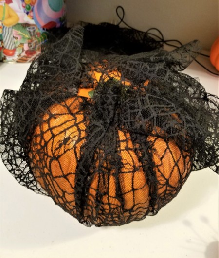 Black Lace and White Ribbon Pumpkin - continue pulling up the lace and pin in place