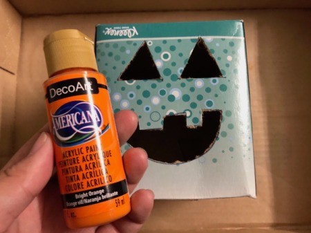 Cardboard Halloween Pumpkin and Ghost - tissue pumpkin box and hand holding orange paint