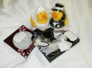 A variety of wedding favors, including a bride and groom rubber ducky.