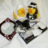 A variety of wedding favors, including a bride and groom rubber ducky.