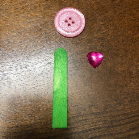 Birthday Cake Gift Box - half stick, pink button, and a heart gem used to make the candle