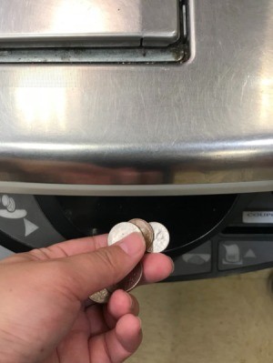 Using coins at the self check out line at the grocery store.