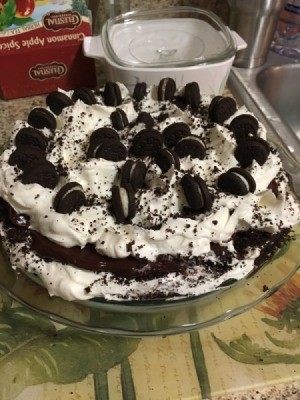 Oreo Cookies stood up on Cream Pie