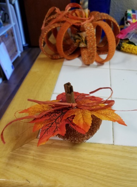 Dollar Tree Tiny Scrubber Pumpkins - add a raffia bow