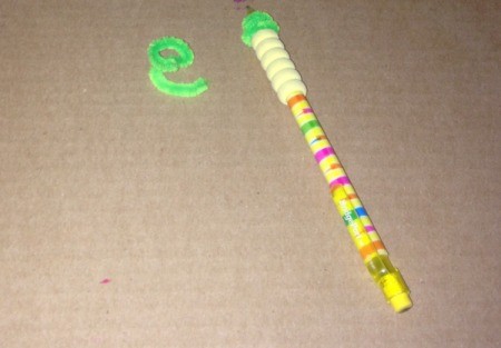Milk Lid Pumpkin Magnets - wrap green pipe cleaners around the pencil to make the vines