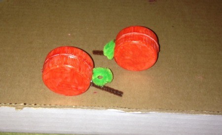 Milk Lid Pumpkin Magnets - glue the remaining two orange lids to the first ones