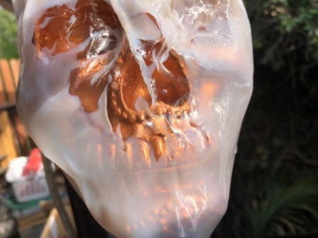 Milk Jug Skulls - keep heating the details -eyes and nose- until clear