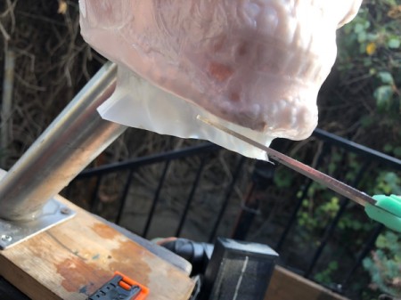 Milk Jug Skulls - trim excess plastic from under the jaw