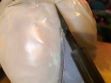 Milk Jug Skulls - heat up the hot knife and cut along the lines