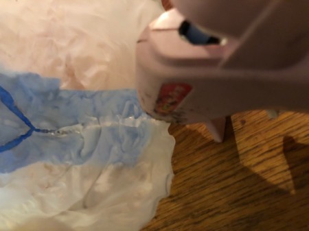 Milk Jug Skulls - seal the incision with hot glue from the inside and allow to dry