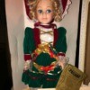 Value of a Seymour Mann Doll - blond doll wearing a green dress with crimson detail