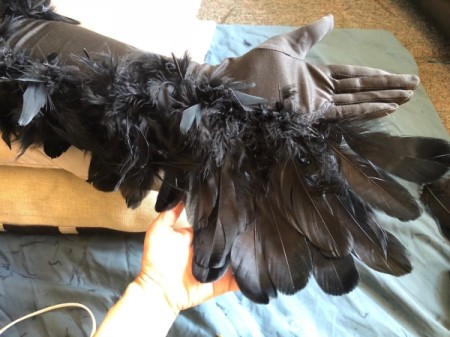 Raven Masquerade Costume - continue adding long feathers angling and panning out