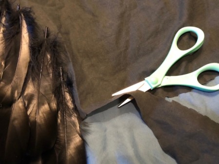Raven Masquerade Costume - tuck into costume bottom and check in mirror, cut to correct length and continue adding feathers to outside