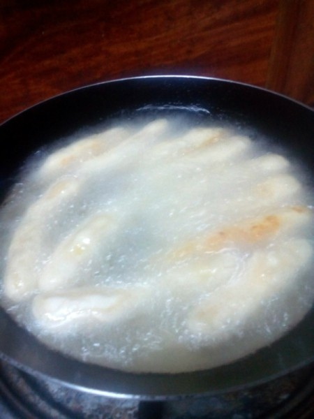 cooking Potato Fingers in hot oil