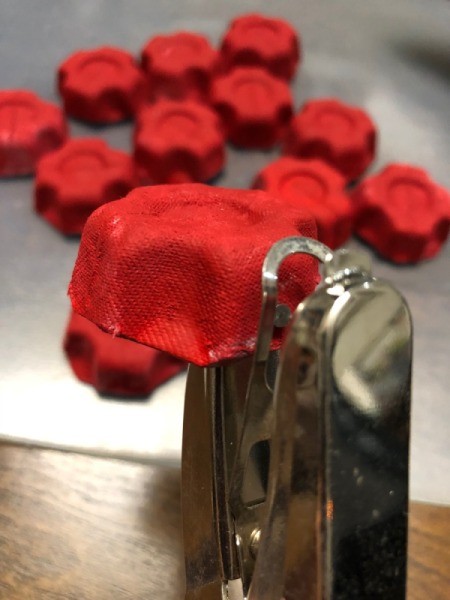 Christmas Egg Carton Wreath - punch a hole in the side of dry cup