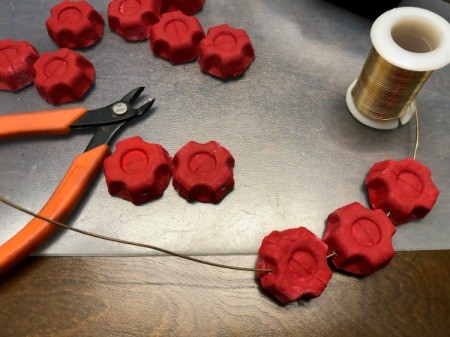 Christmas Egg Carton Wreath - three pieces threaded onto wire coming off spool