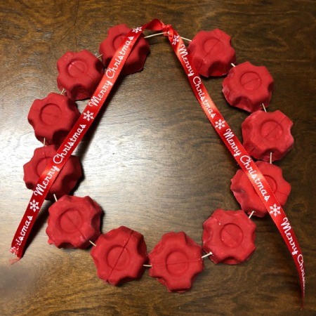 Christmas Egg Carton Wreath - bit of Merry Christmas ribbon tied to center of the wreath and glued in place