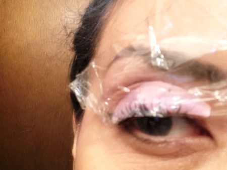 DIY Long-Lasting Eyelash Lift - remove first piece of wrap and remove perming solution, add setting lotion and recover for same time length