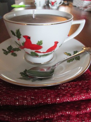 Using Leftover Candle Wax For Gifts - tea cup candle on saucer with a spoon