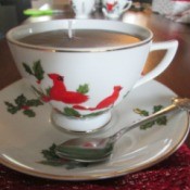 Using Leftover Candle Wax For Gifts - tea cup candle on saucer with a spoon