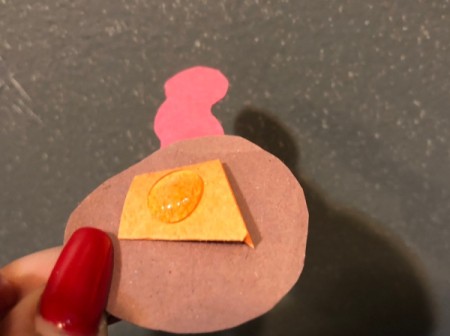 Pinecone Turkey - add a blog of hot glue to the folded paper