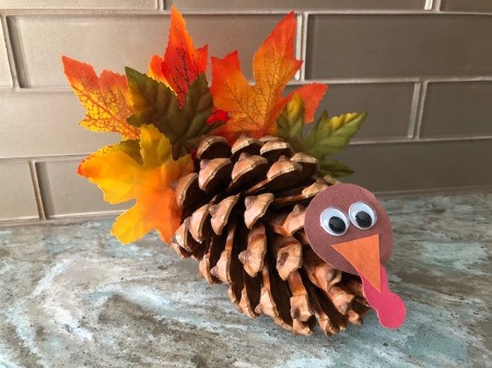 Pinecone Turkey - attach the head to the front of the pinecone and hold until set
