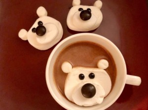 Marshmallow Polar Bears - two finished bears next to a cup of chocolate with a floating, melting polar bear