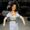Identifying a Porcelain Doll Maker - doll wearing a long narrow blue dress and fingerless long lace gloves