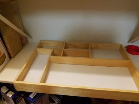 A shadowbox frame with different sized sections.