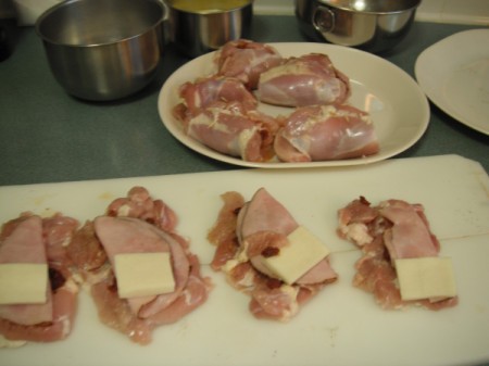 cheese and ham on chicken pieces