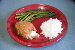 Mozzarella and Ham Chicken Thigh on dinner plates