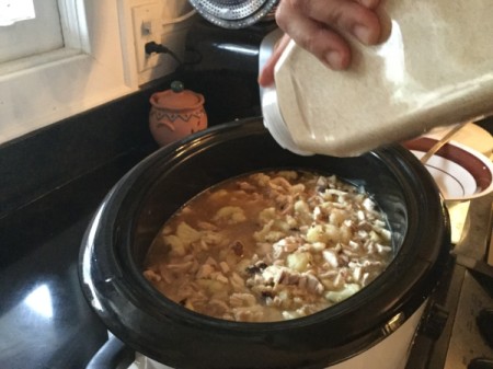 adding spices to pot