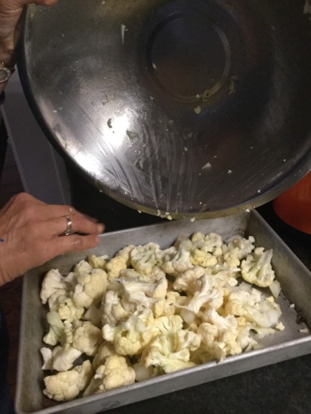 putting cauliflower in roasting pan