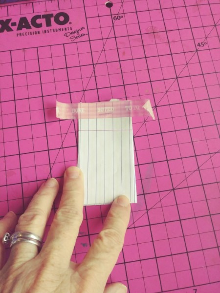 Notepad Stocking Stuffers - apply a piece of washi tape over the staple