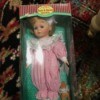 Value of a Hearts and Harvest Memories Doll  - doll in pink and white jumpsuit in a box