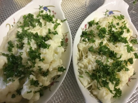 parsley on Cauliflower in 2 serving dishes to bake